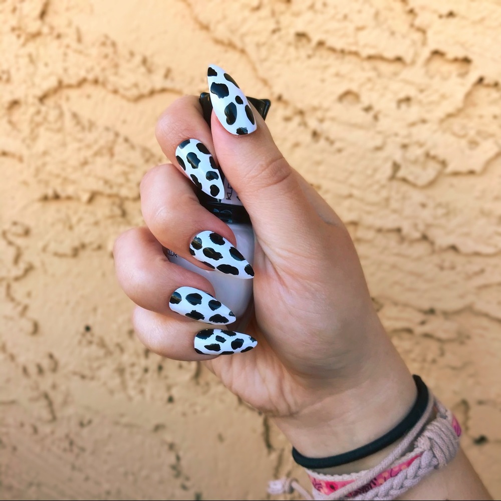 hand-painted cow print false stiletto nails 🐄